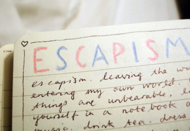 "Escapism" written on a notepad.
