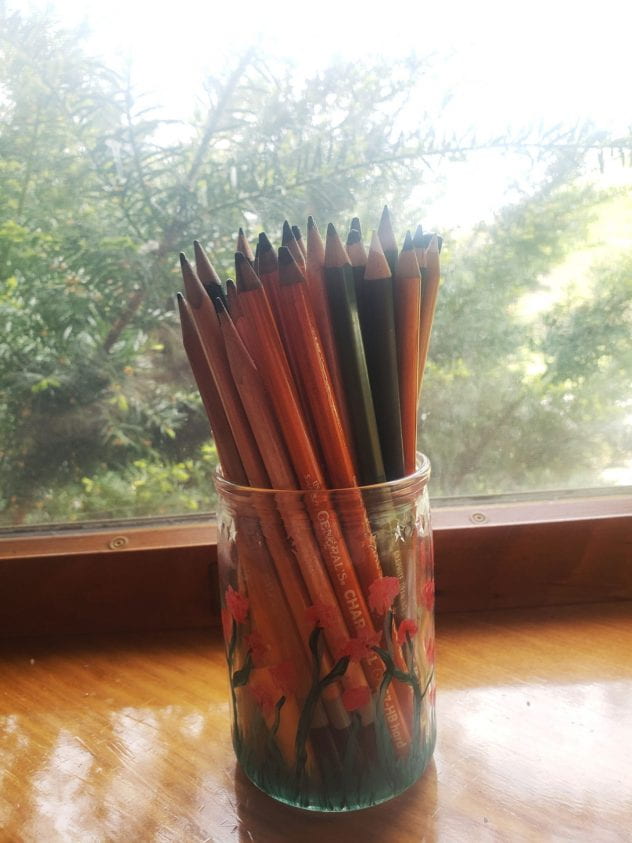 painted glass jar holding pencils